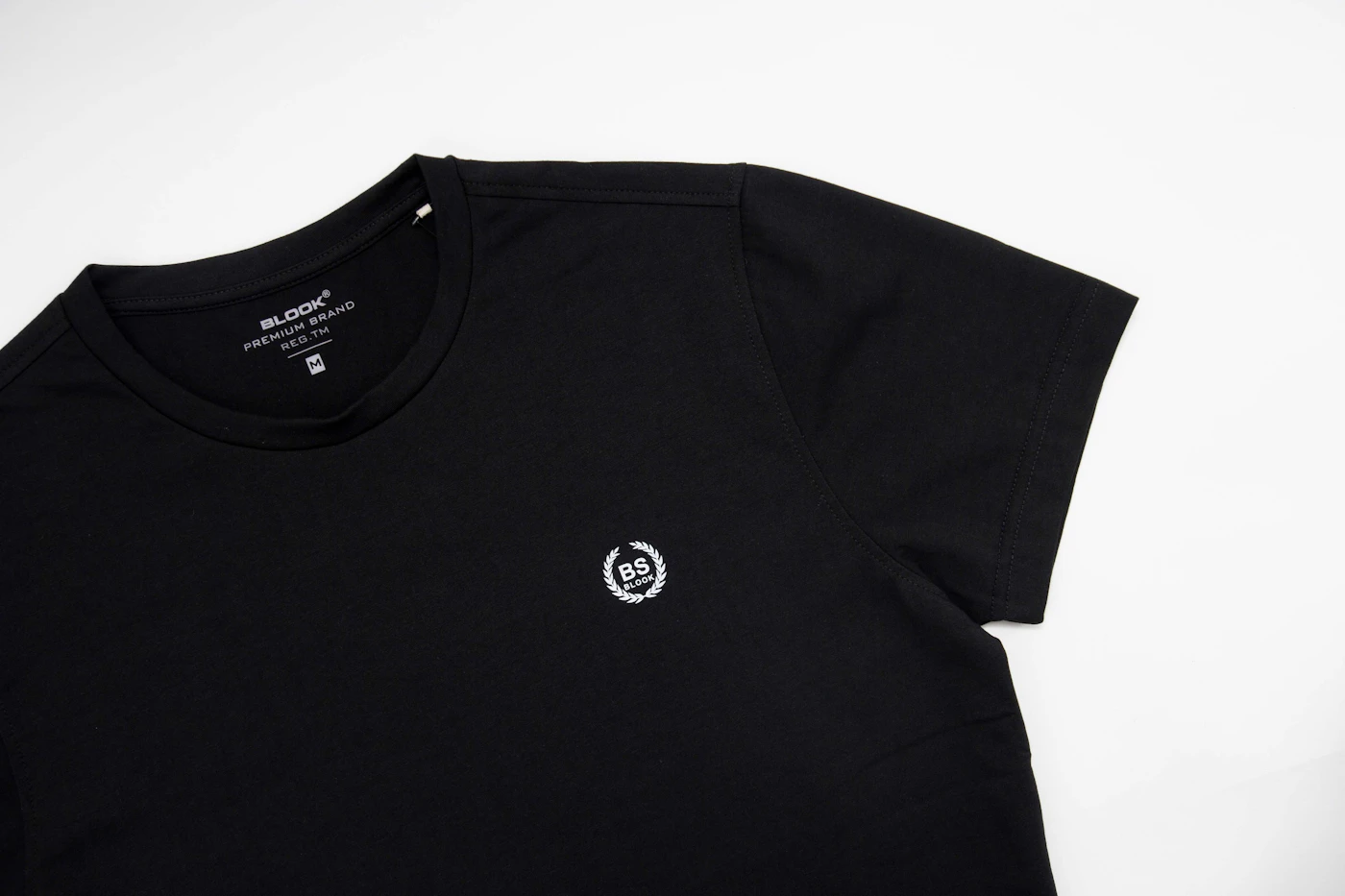 Black t-shirt with a small chest mark