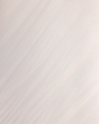 a man riding a snowboard down the side of a snow covered slope