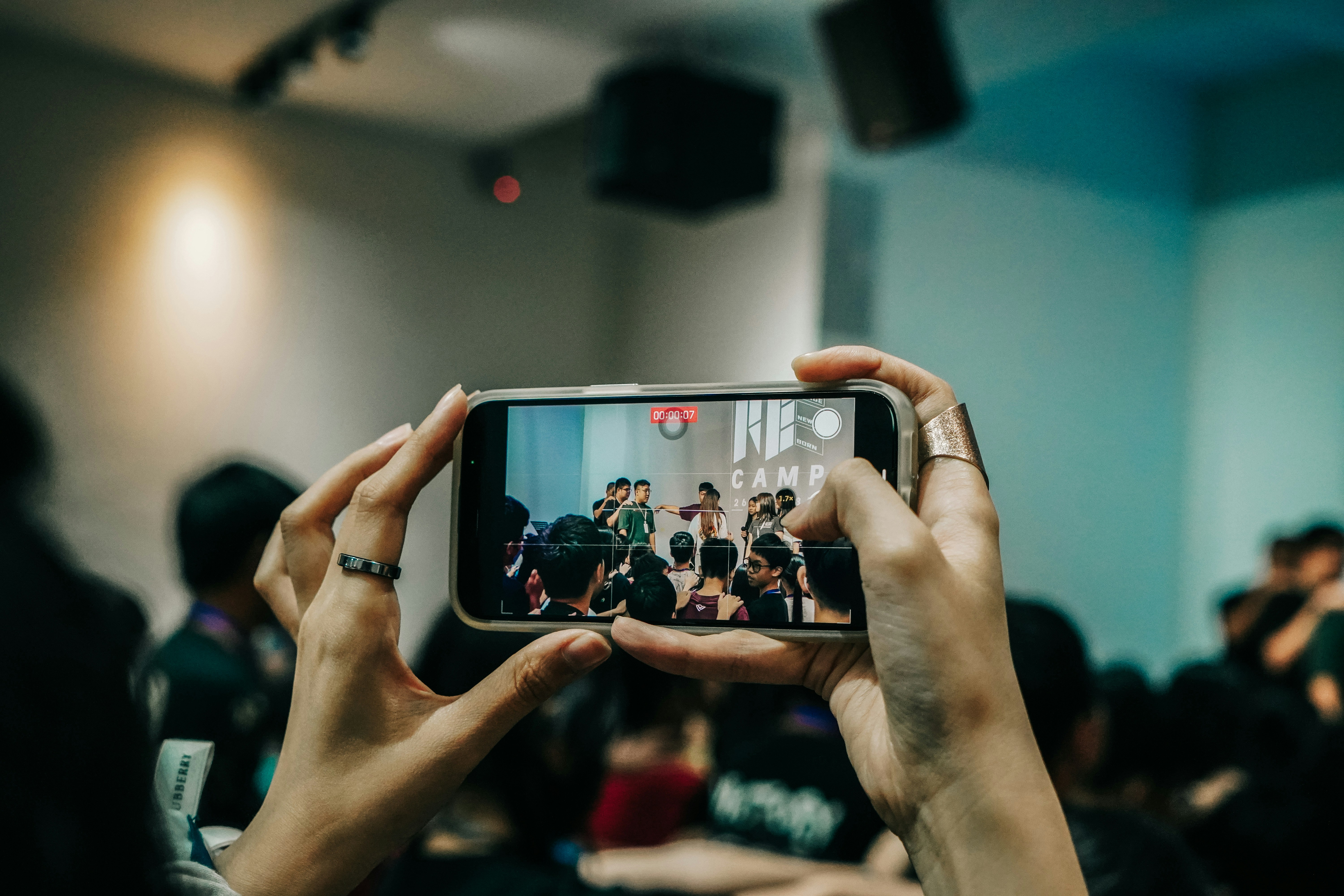 a person taking a picture with a cell phone