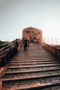 a group of people walking up a set of stairs