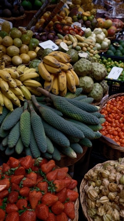 a large display of fruits and vegetables in baskets