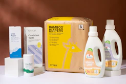 a box of diapers next to a bottle of lotion