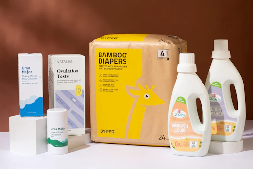 a box of diapers next to a bottle of lotion