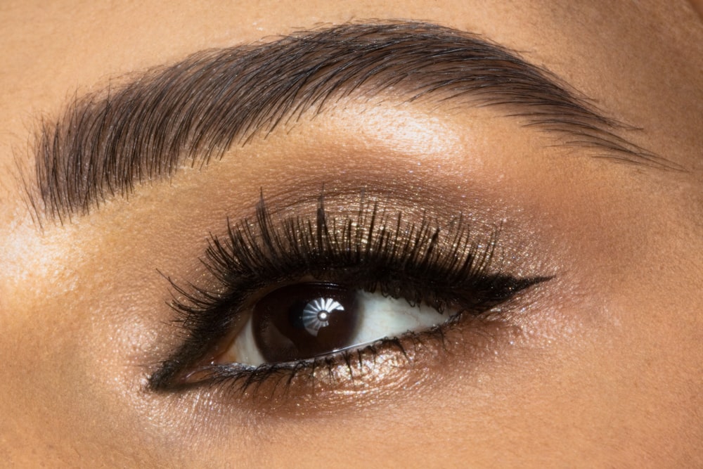  a close up of a woman's eye with long lashes