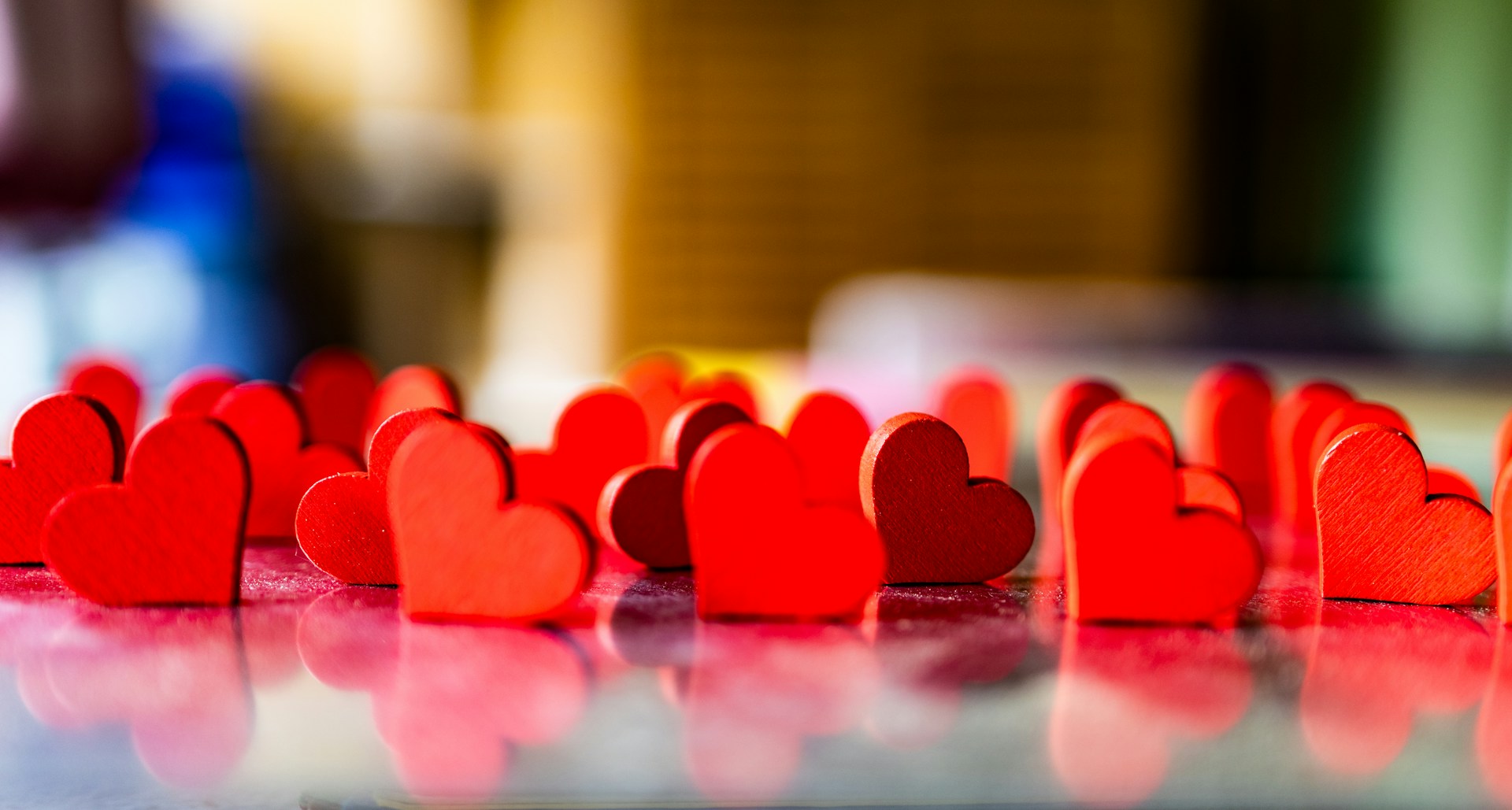 a group of red hearts sitting on top of a table