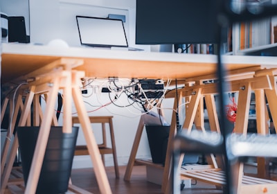 a desk with a laptop on top of it