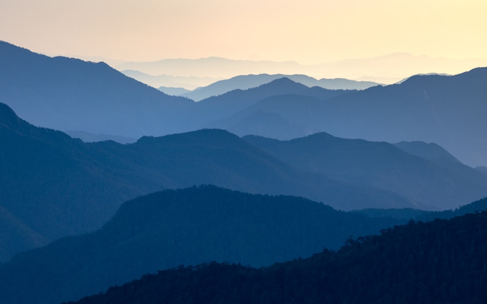  a view of a mountain range at sunset