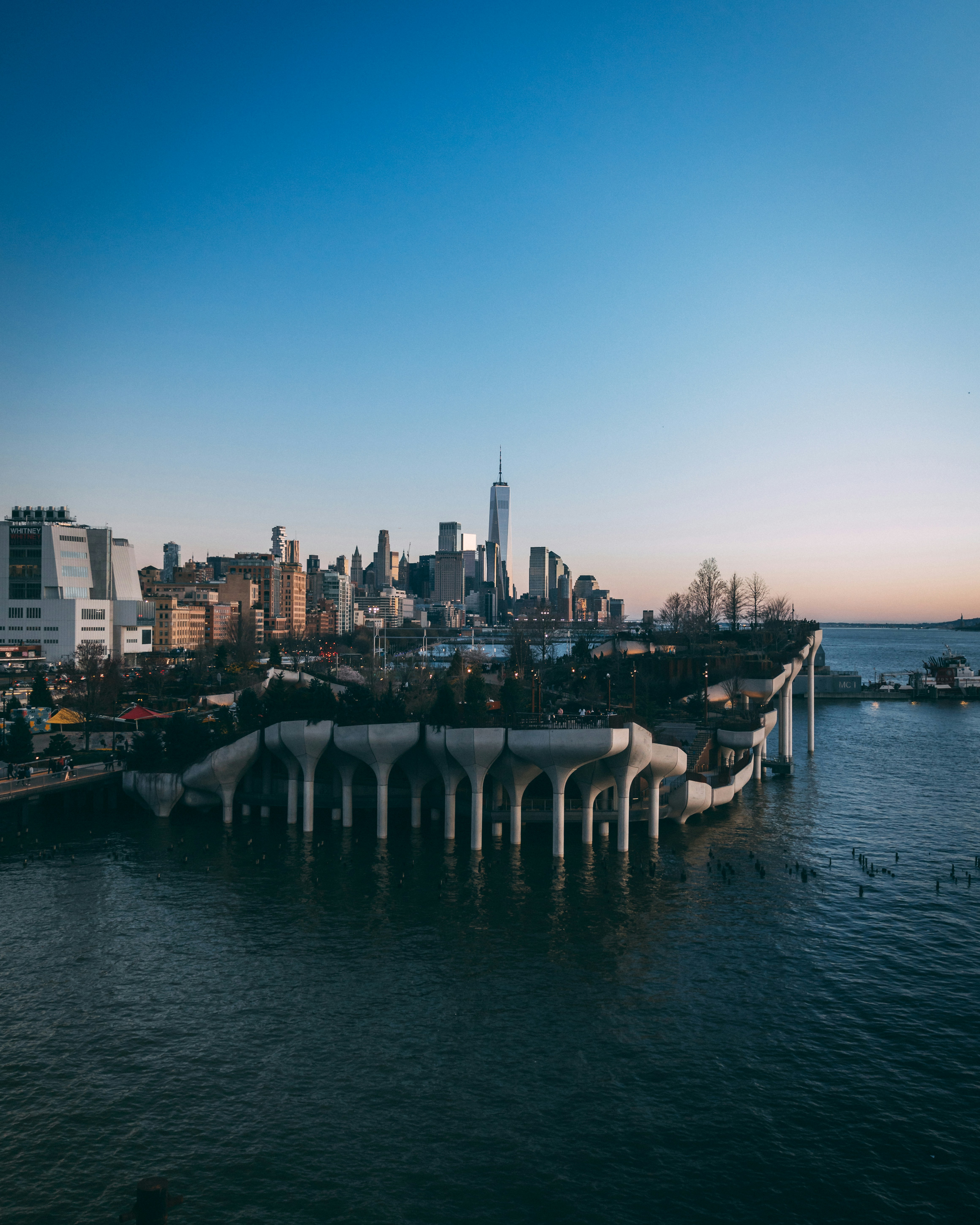 a large body of water with a city in the background