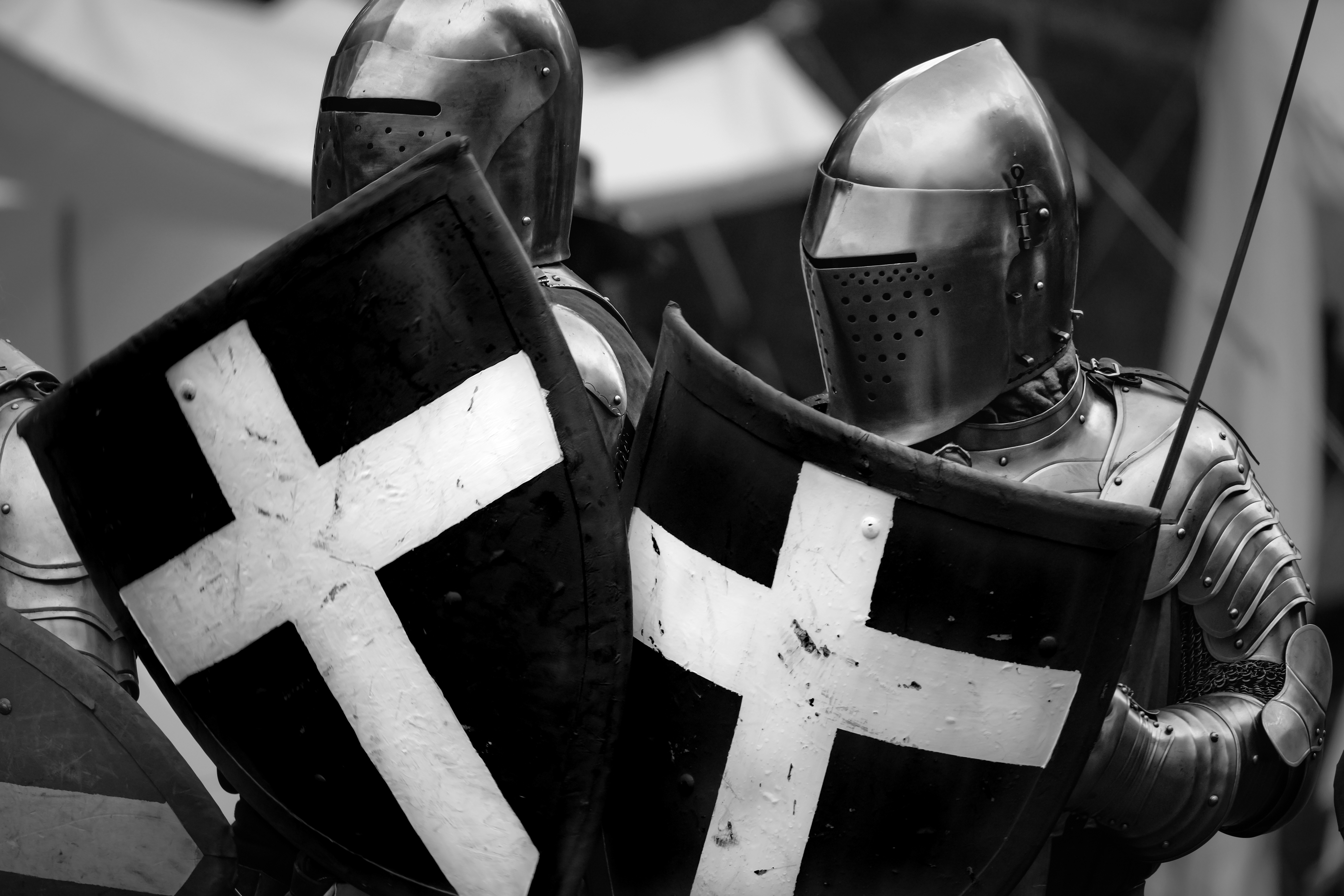 a man dressed in armor holding a sword and shield