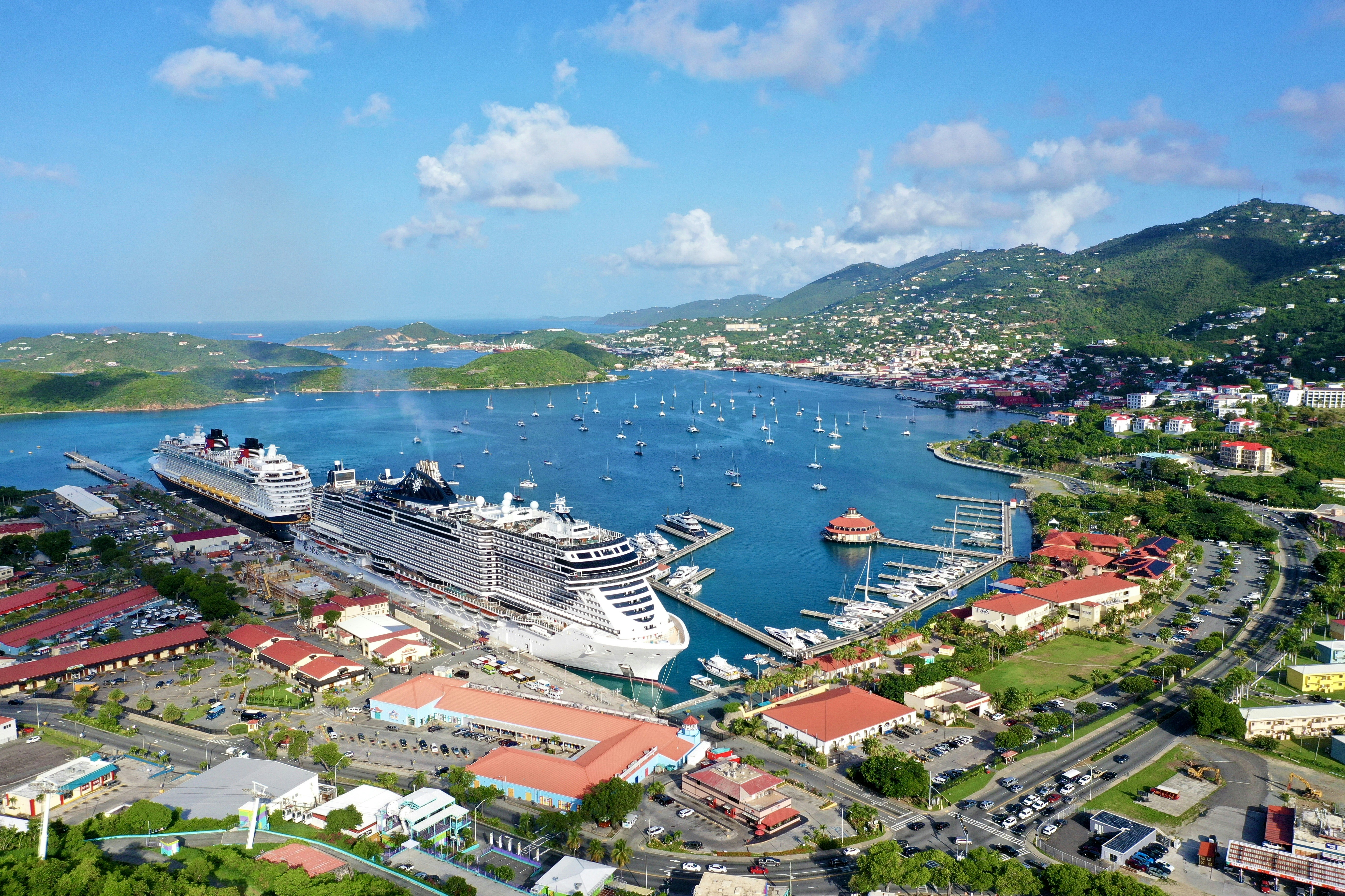 a cruise ship docked in a harbor next to a city