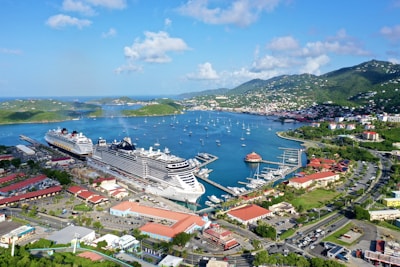 a cruise ship docked in a harbor next to a city