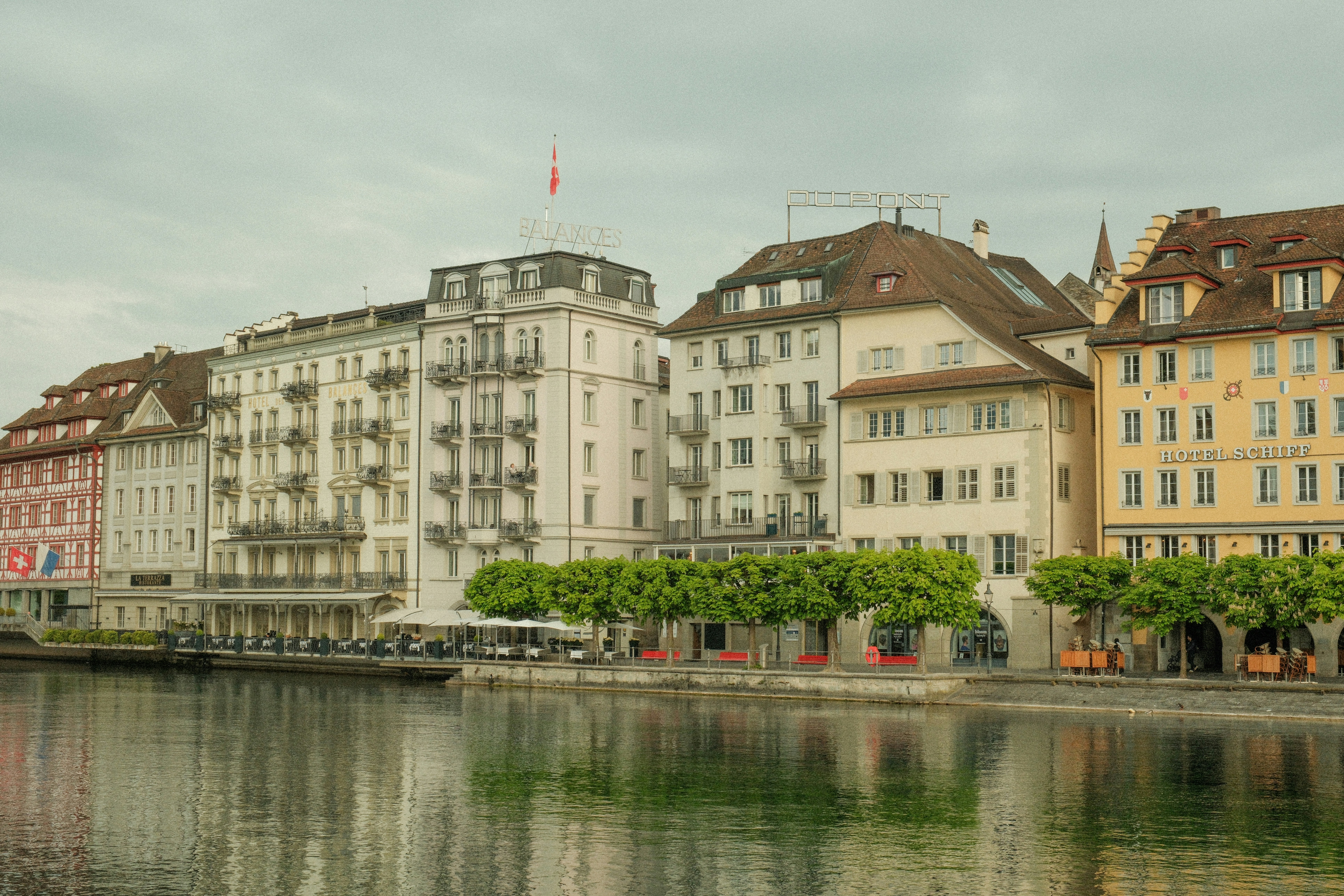 a row of buildings next to a body of water