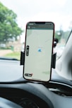 a cell phone mounted to the dashboard of a car