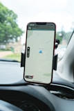 a cell phone mounted to the dashboard of a car