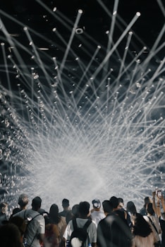 a group of people standing in front of a stage