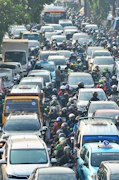 a crowded street filled with lots of traffic