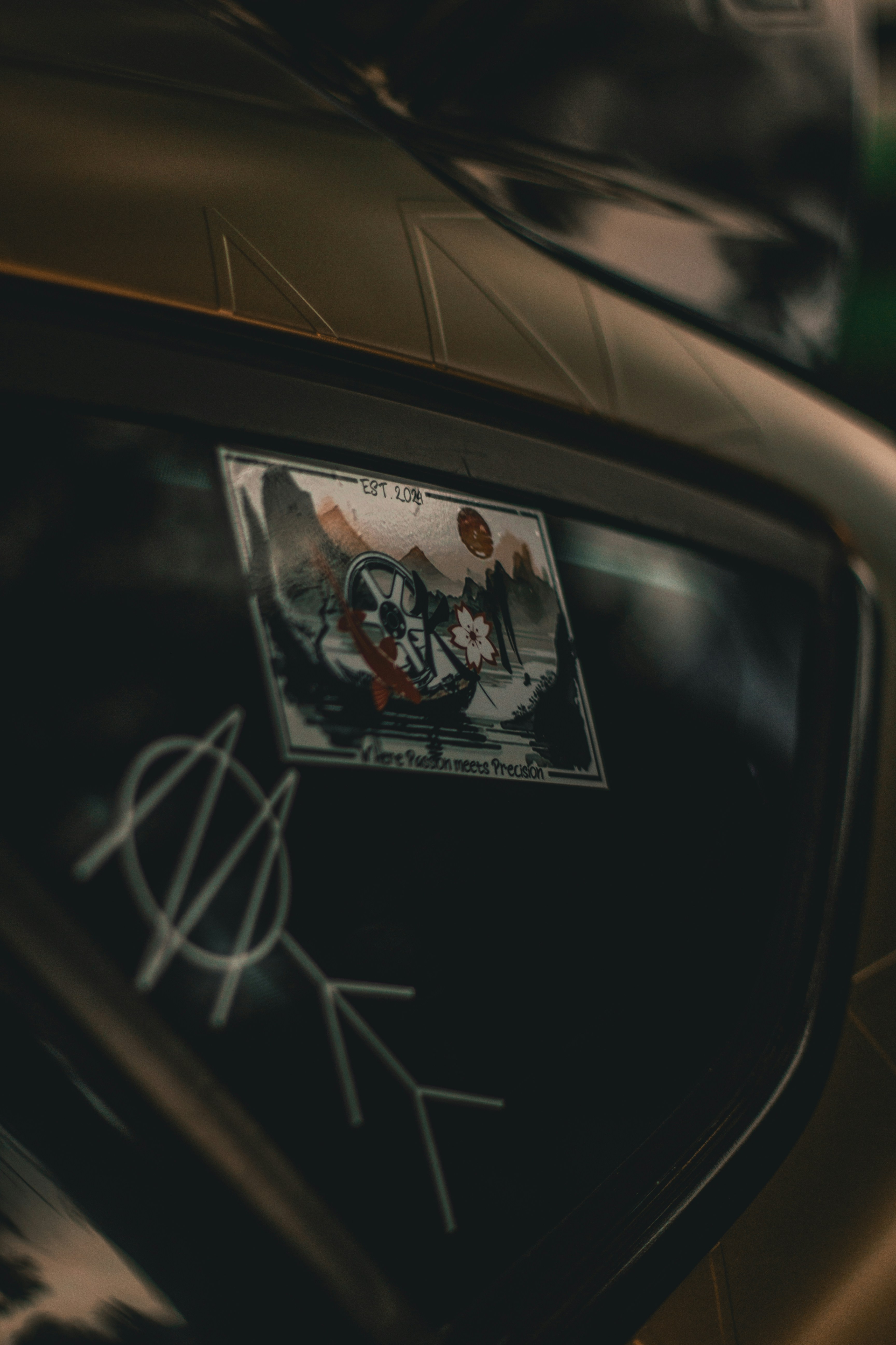 A close up of a car with a sticker on it