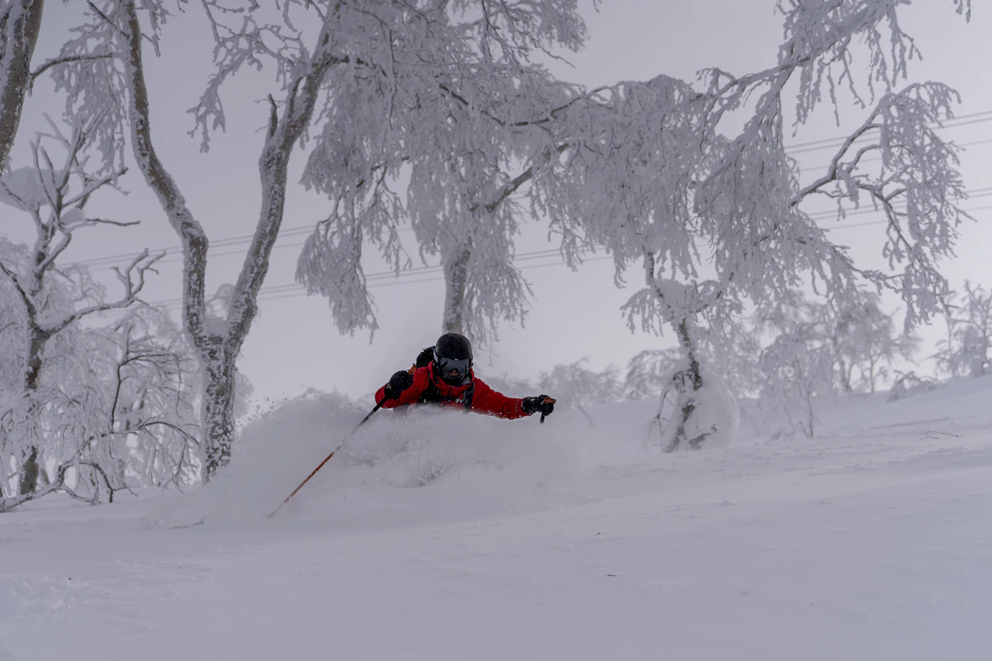 A skier on a snowy slope at Asahidake in Hokkaido, Japan