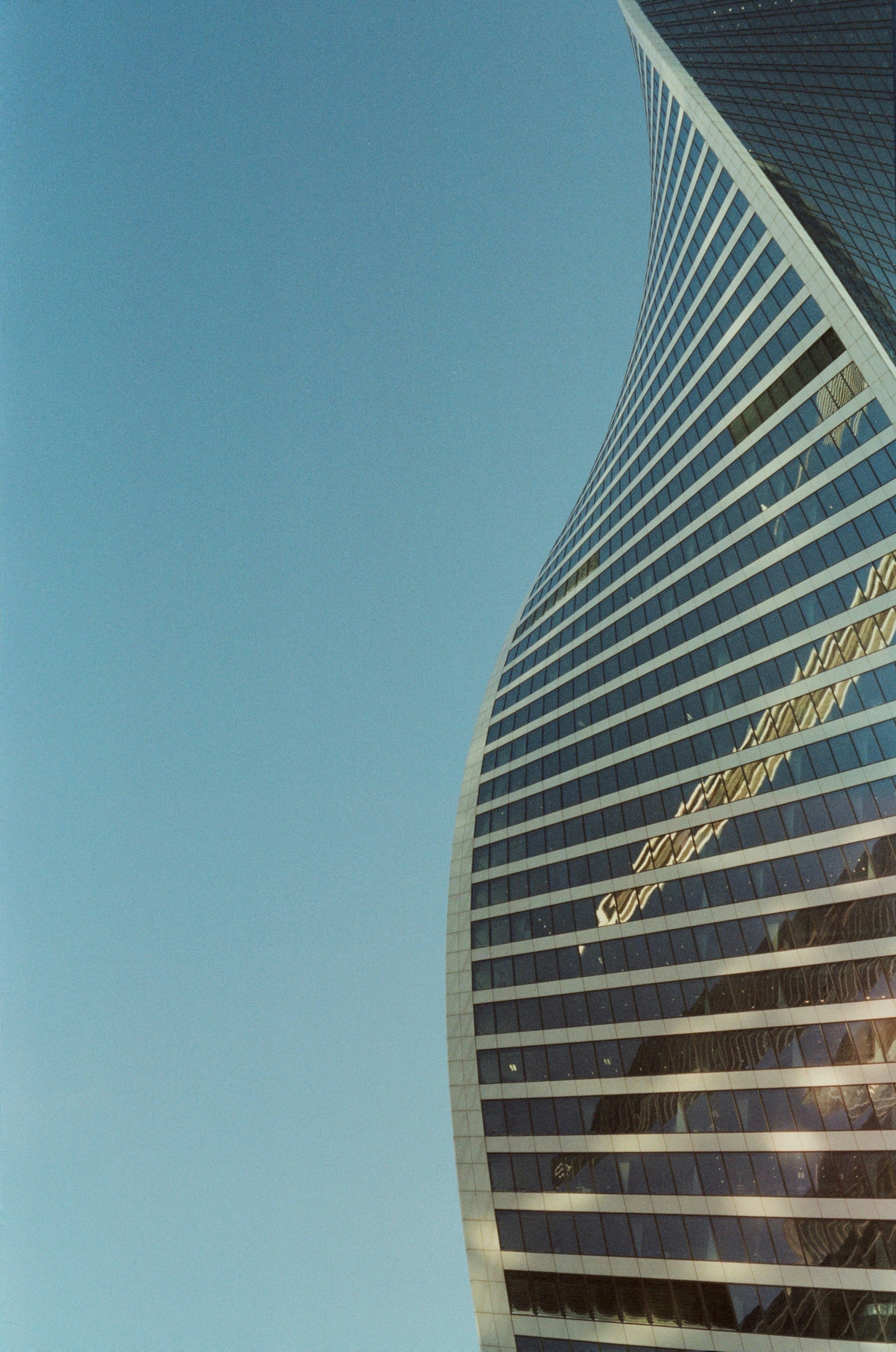a very tall building with a sky background