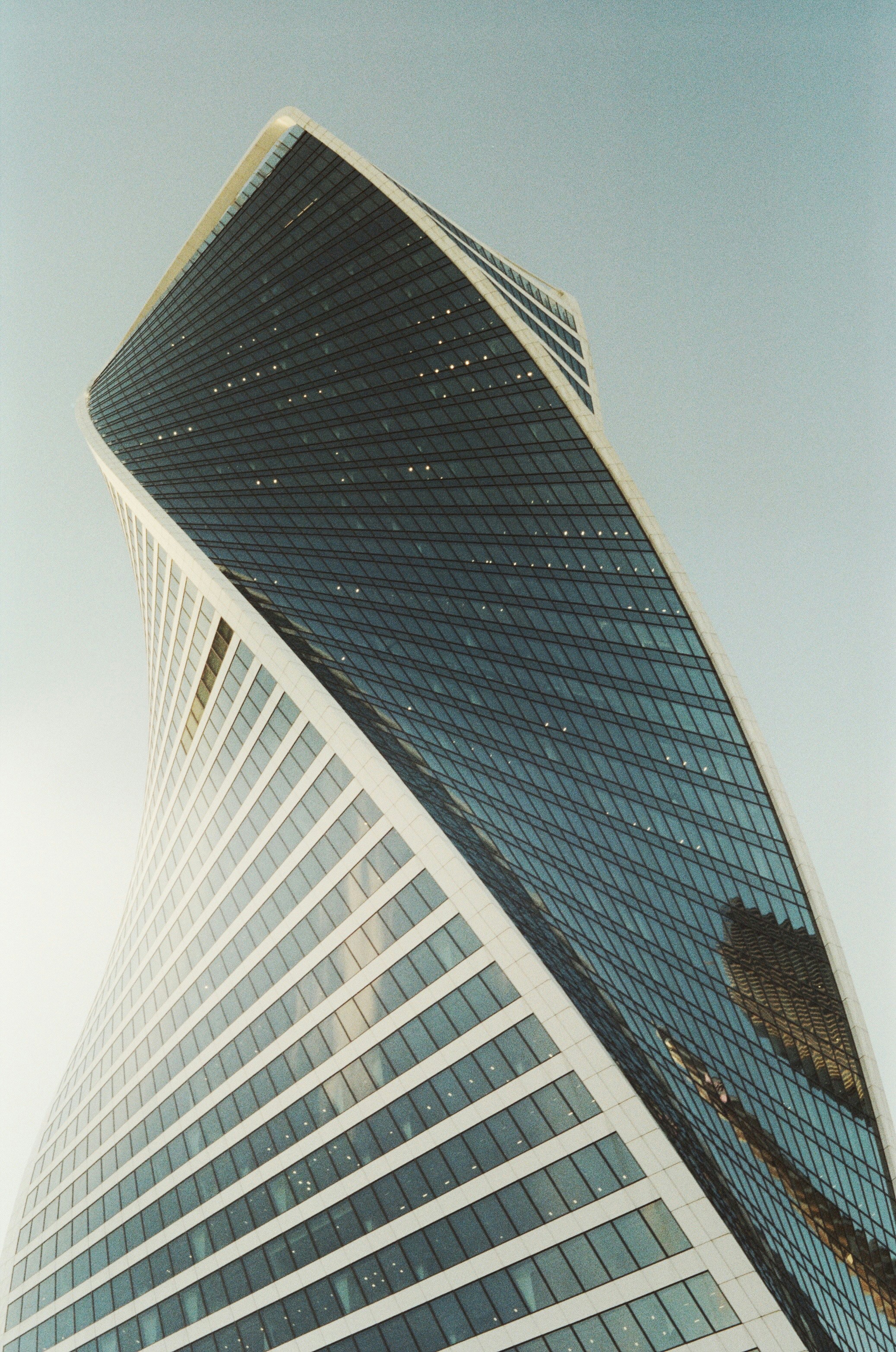 a very tall building with a sky background