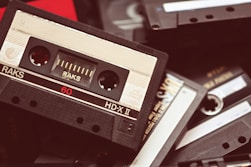 a pile of old cassettes sitting on top of each other