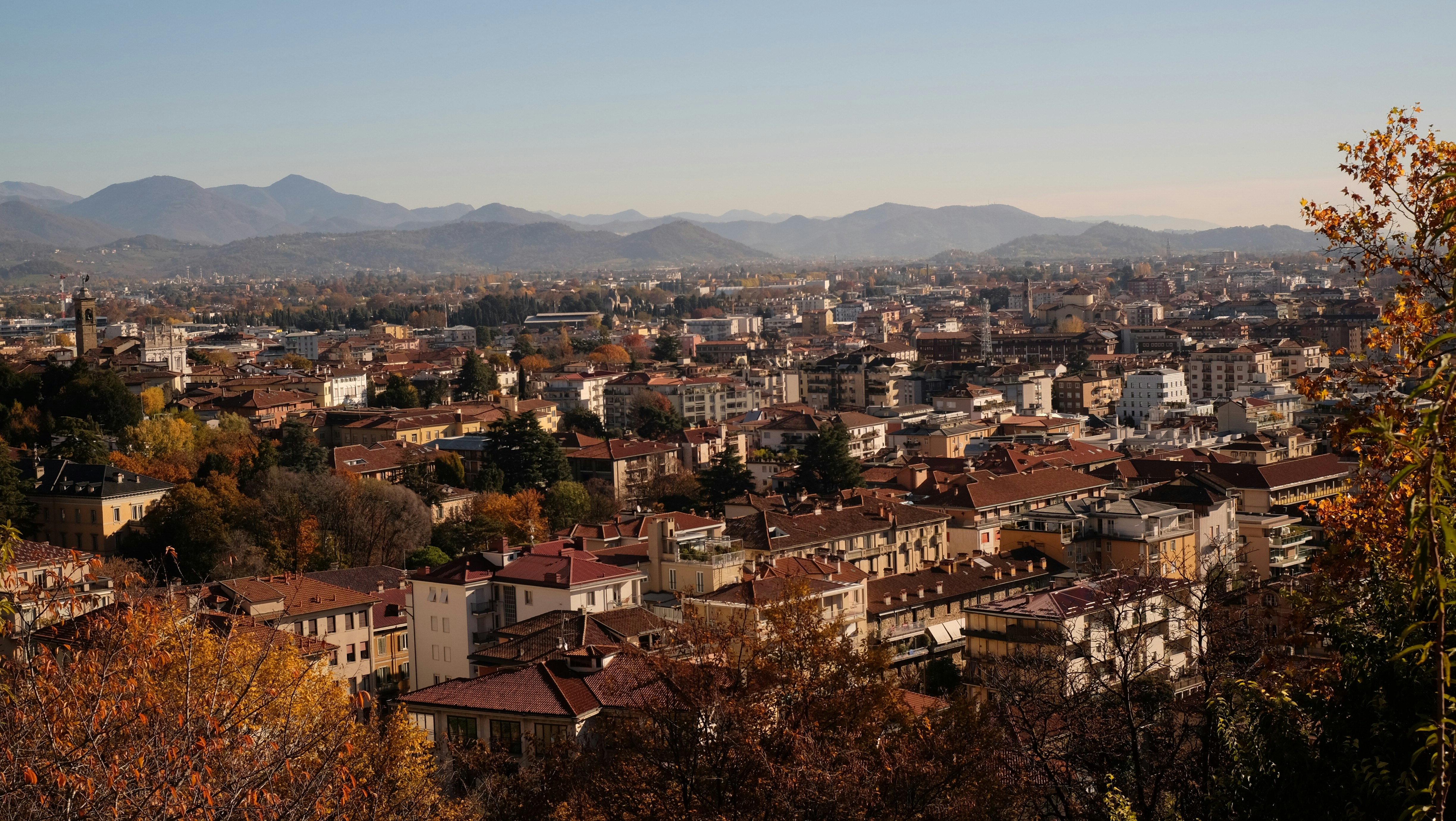 a view of a city with mountains in the background