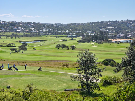 a group of people on a golf course