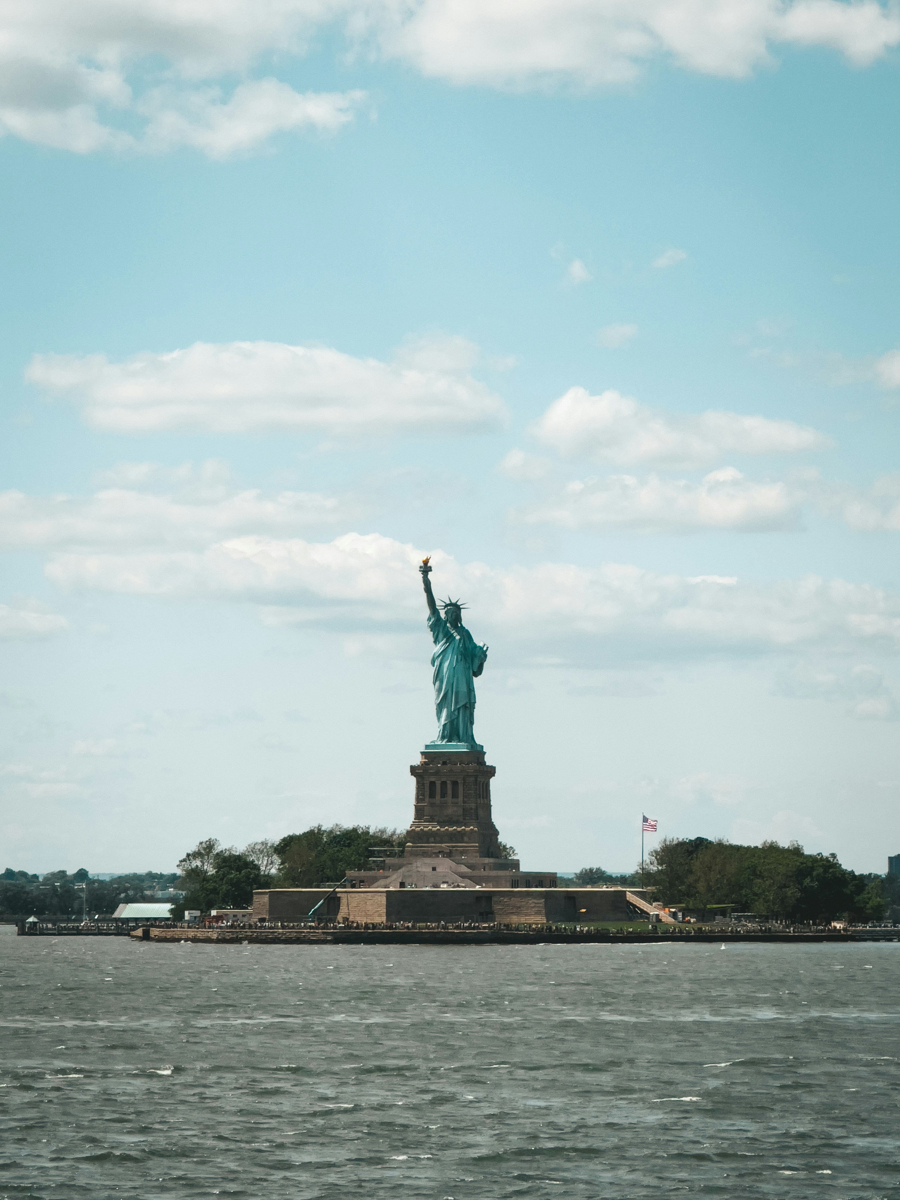 the statue of liberty is in the middle of the water