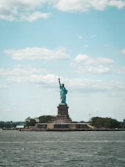 the statue of liberty is in the middle of the water