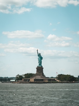 the statue of liberty is in the middle of the water