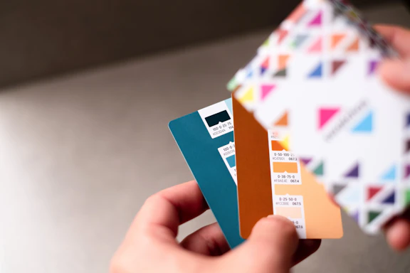 a person holding a credit card in their hand