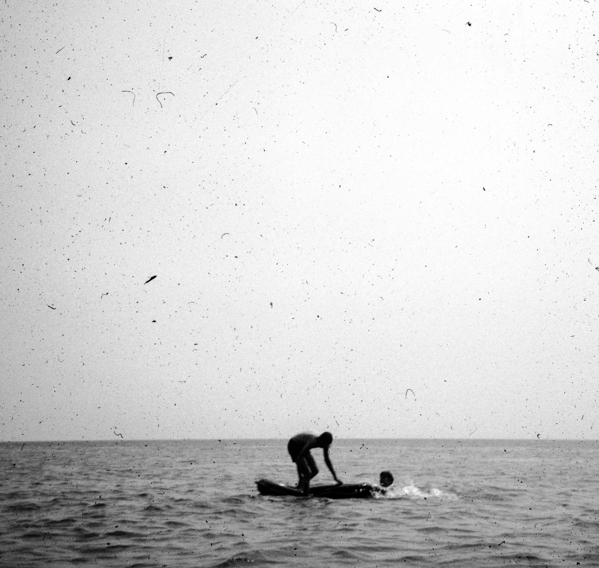 a person riding a surfboard on top of a body of water