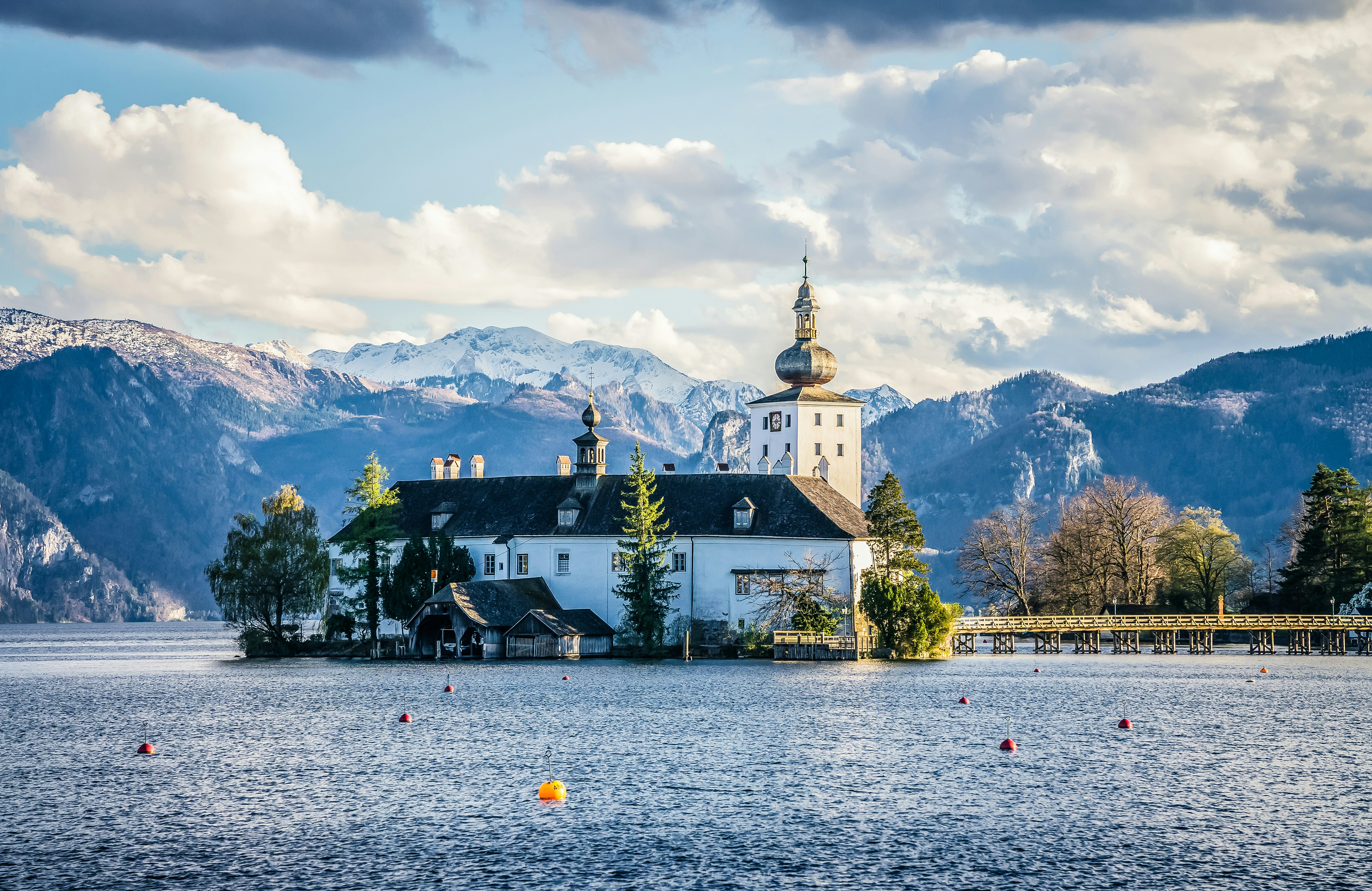 a church on a small island in the middle of a lake