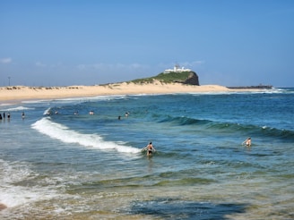 a group of people swimming in the ocean