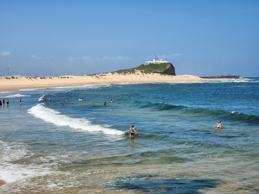 a group of people swimming in the ocean