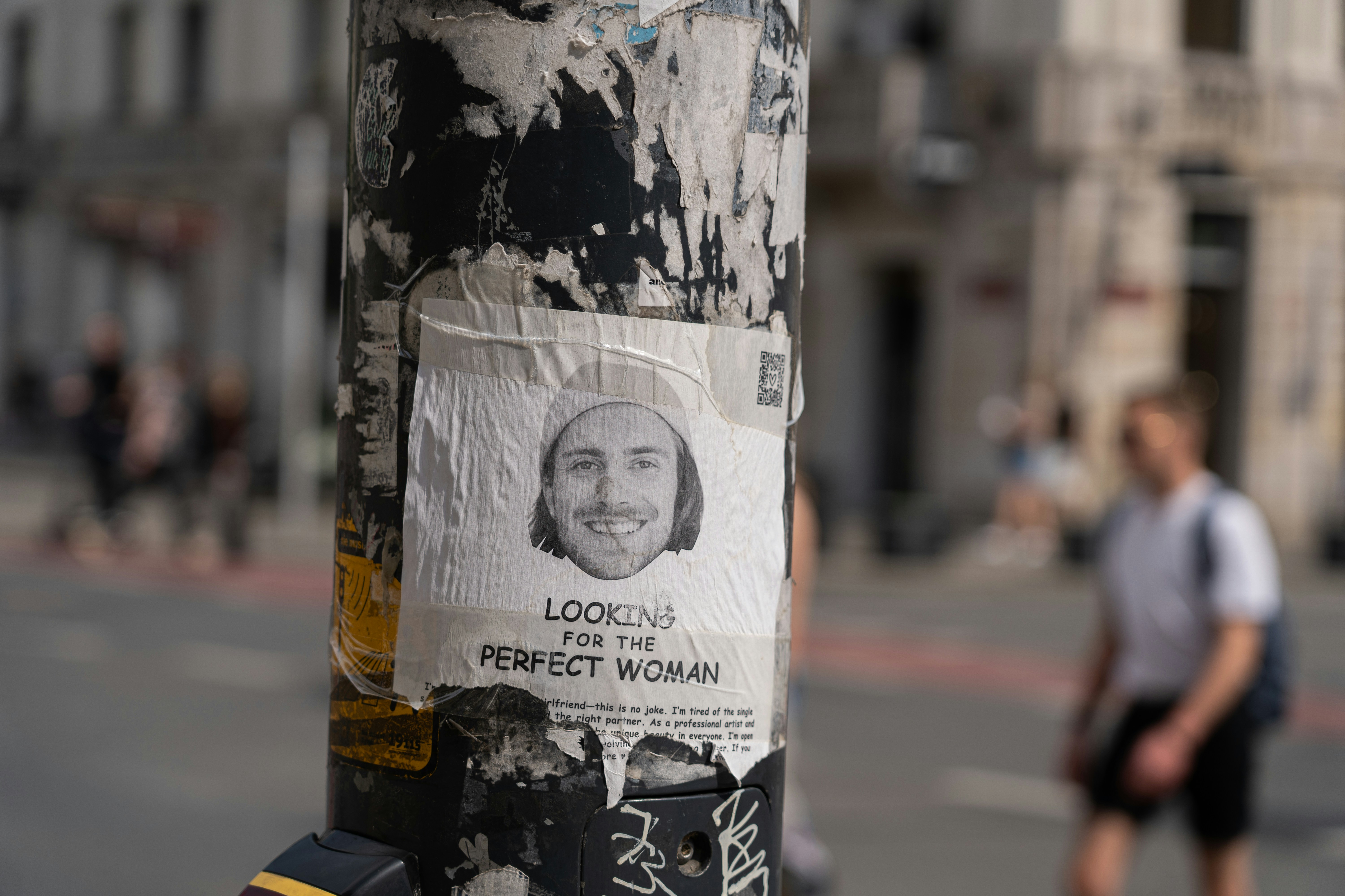 a pole with a bunch of stickers on it