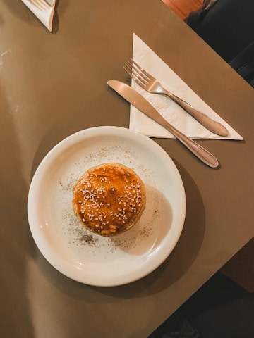 a white plate topped with a piece of cake