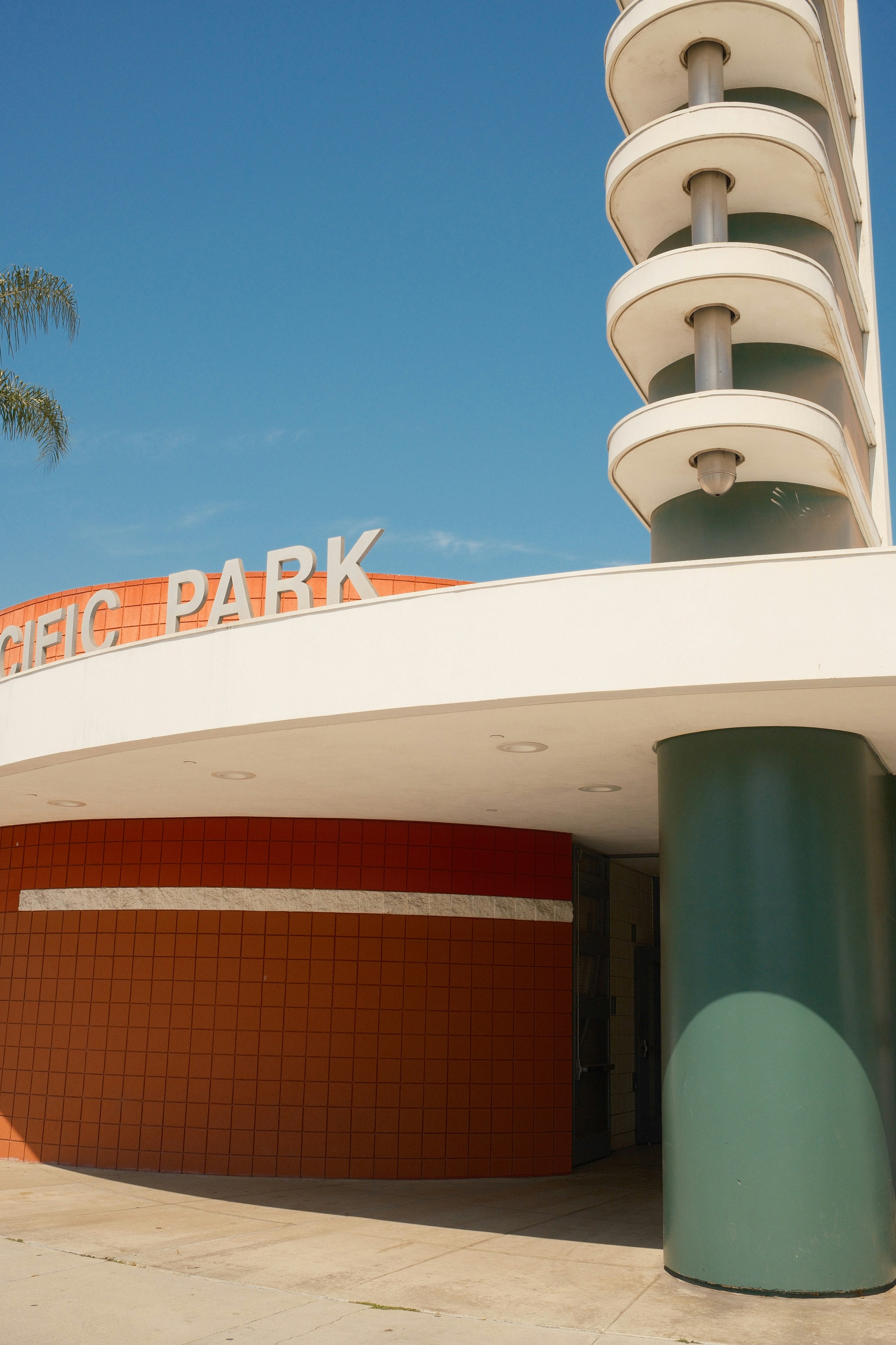 a tall building with a sign on top of it