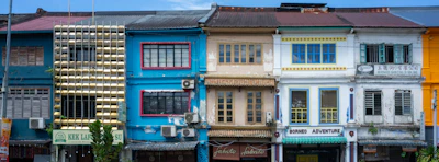 a row of multicolored buildings in a city