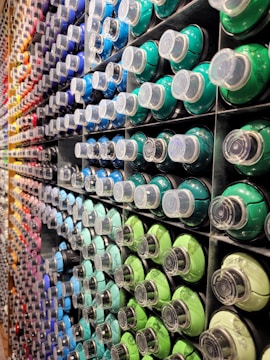 a display of different colors of toothpaste in a store