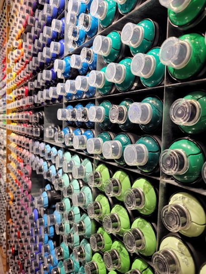 a display of different colors of toothpaste in a store