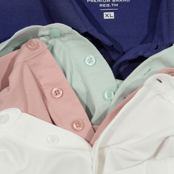 a group of three shirts sitting next to each other