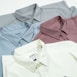 a group of four men's shirts sitting next to each other