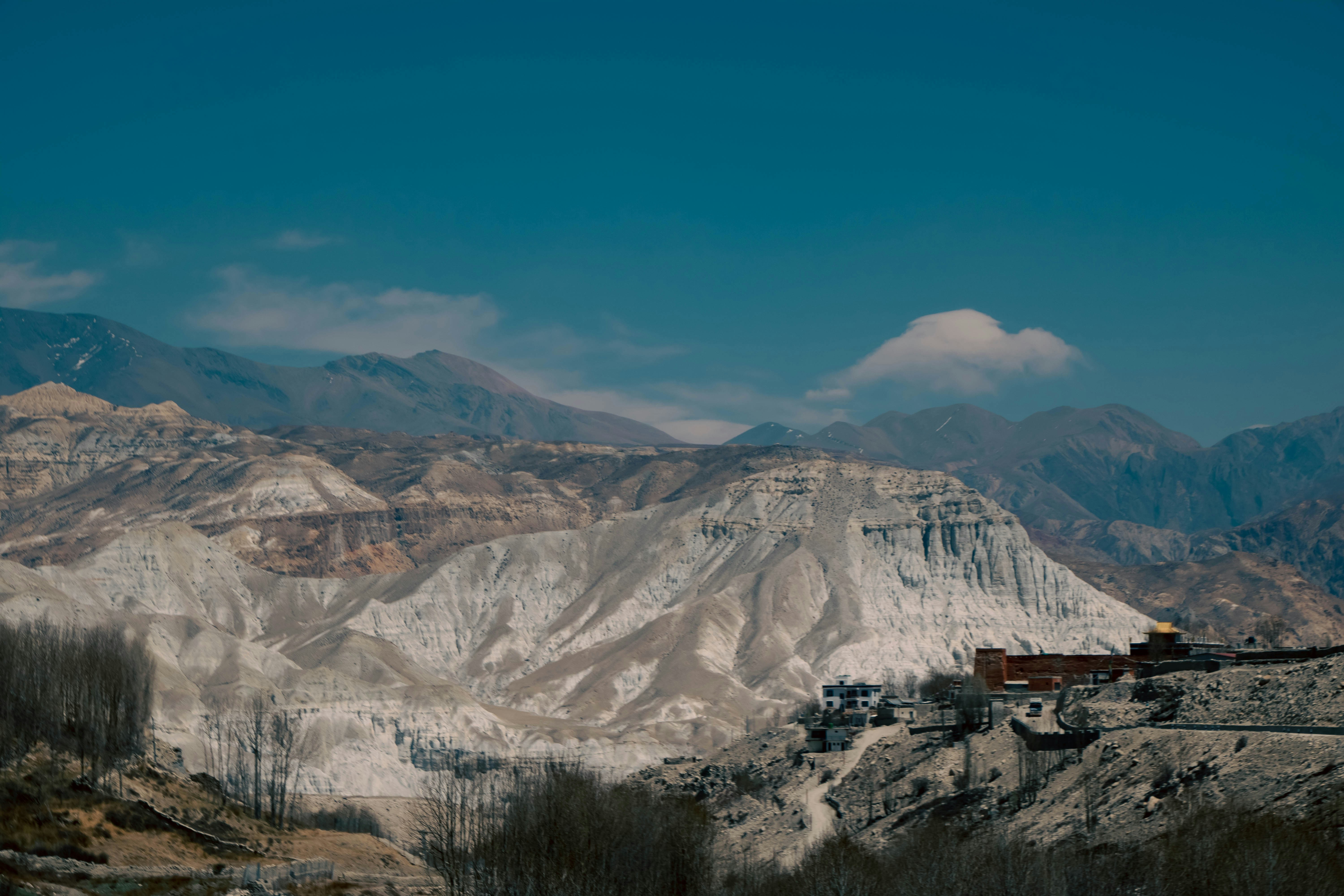 a mountain range with a train on the tracks