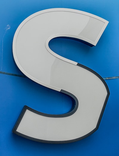 a close up of the letter s on a sign