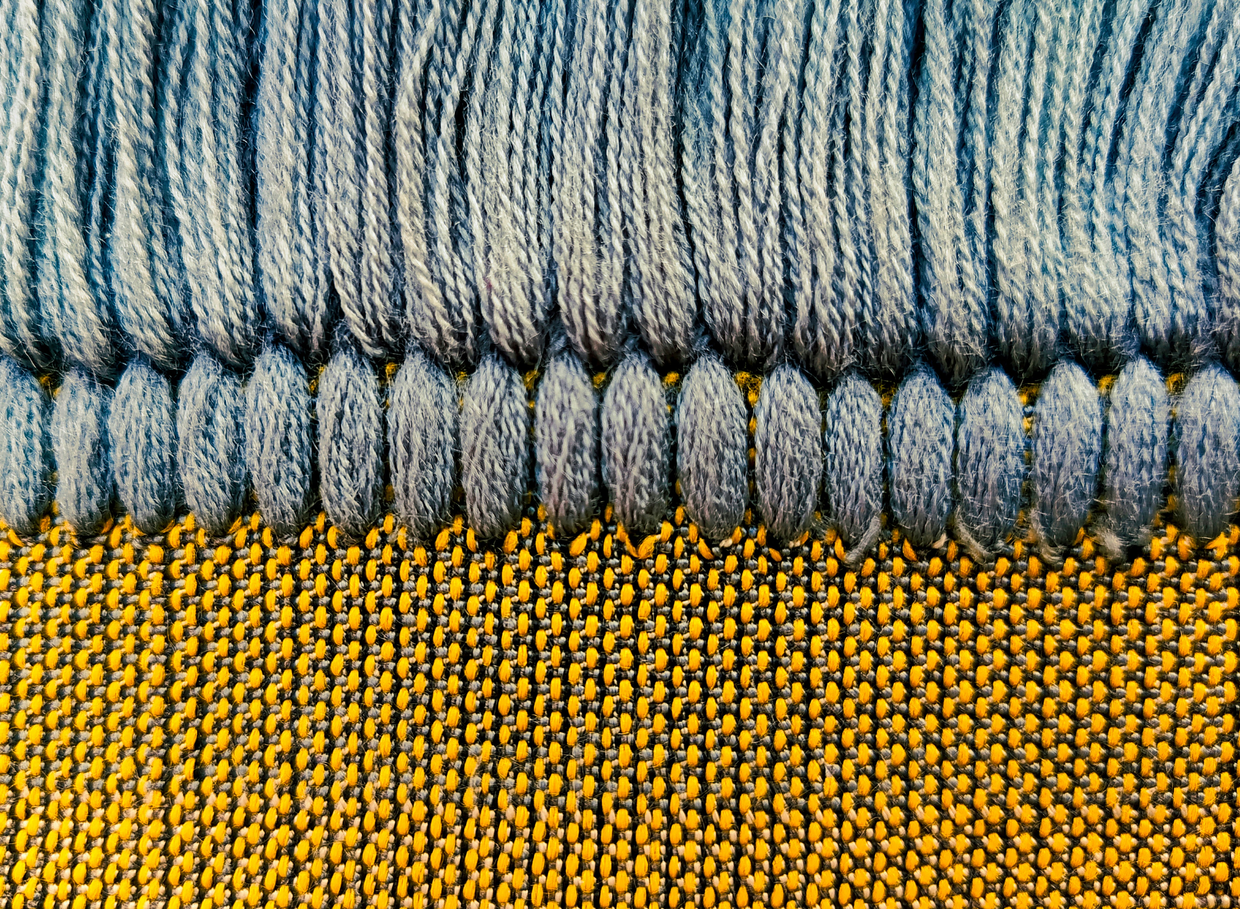 a close up of some blue and yellow material