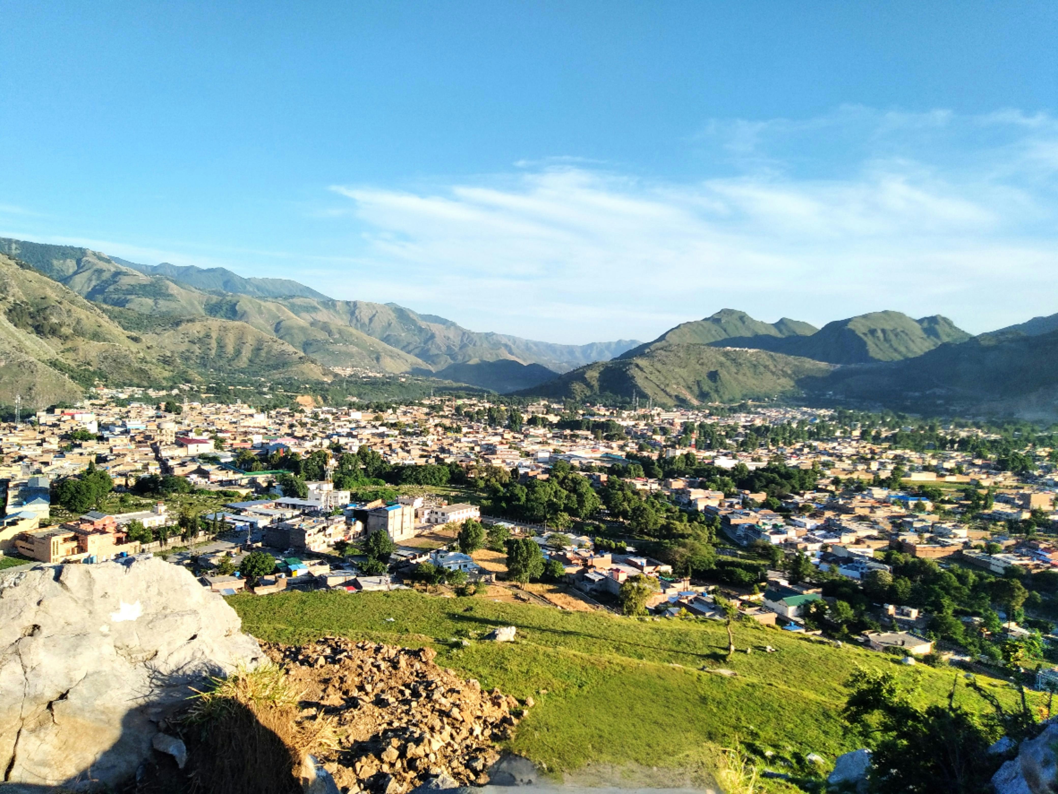 a view of a small town in the mountains