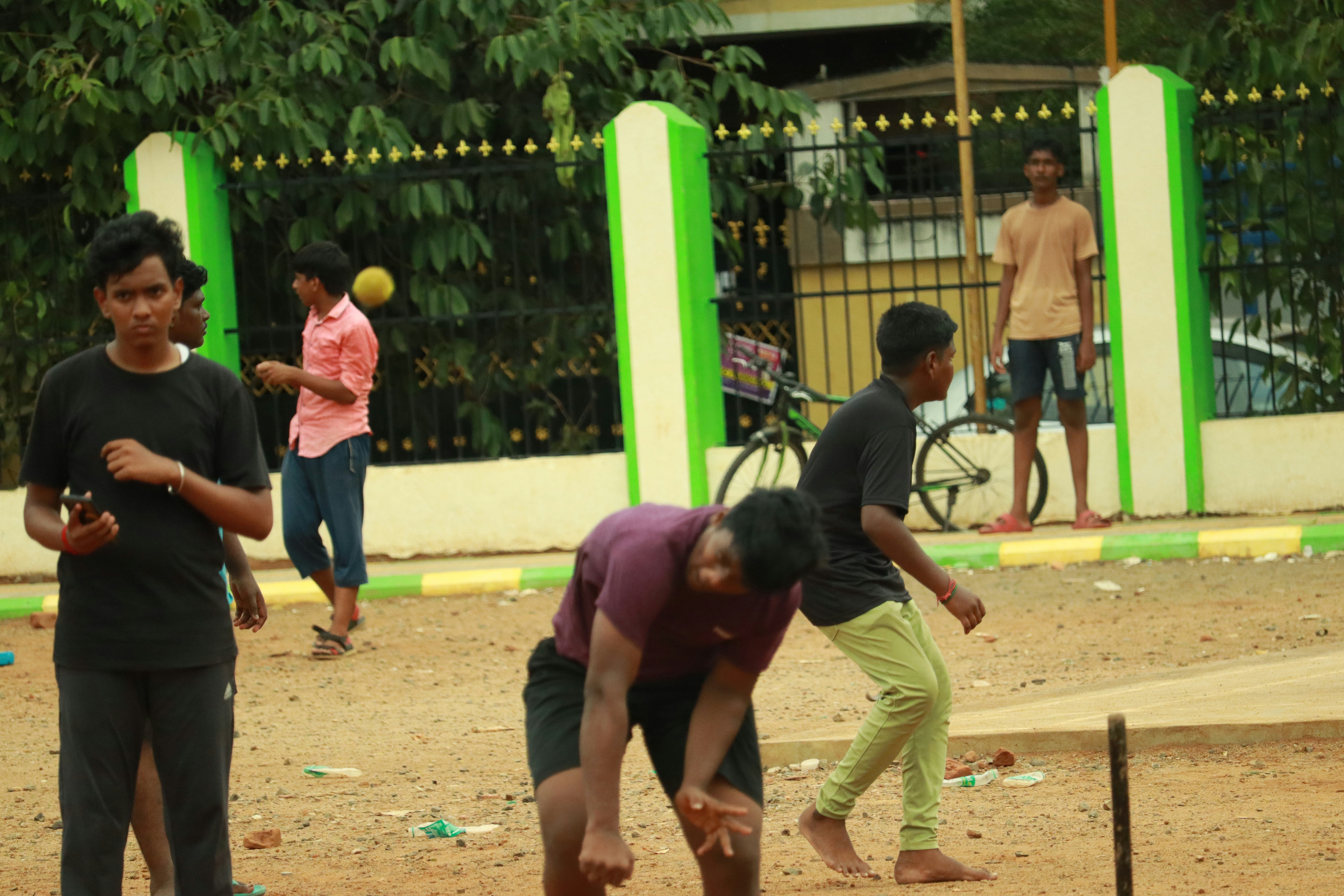 a group of young men playing frisbee