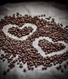 a close up of coffee beans on a cloth