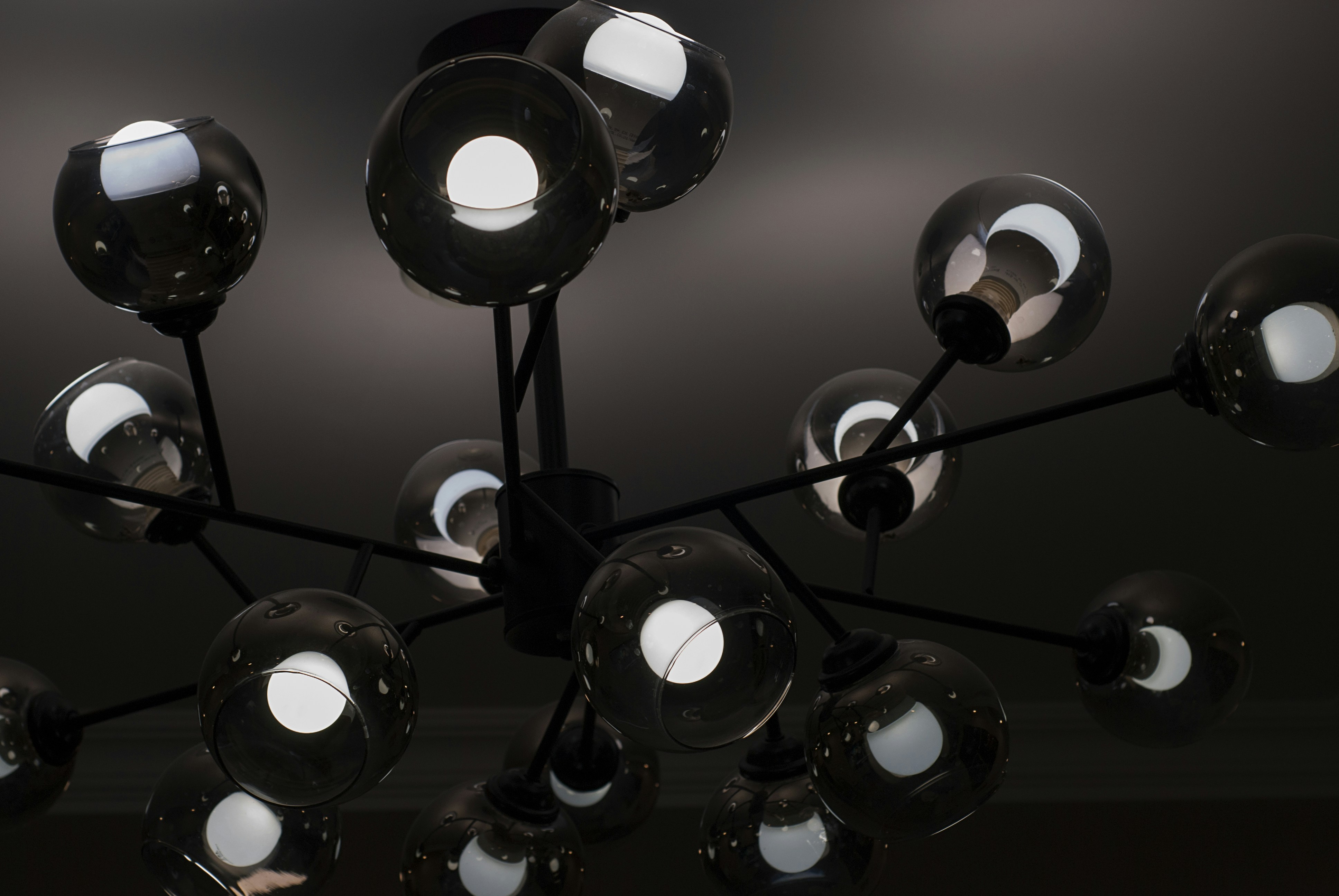 a chandelier with a bunch of lights hanging from it